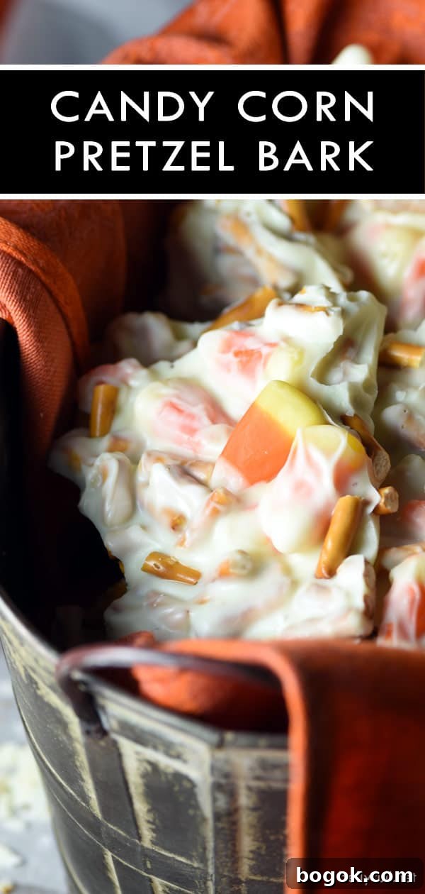 Candy Corn Pretzel Bark is the ultimate Halloween treat with white chocolate, candy corn, and pretzels! Halloween Candy Corn Pretzel Chocolate Bark