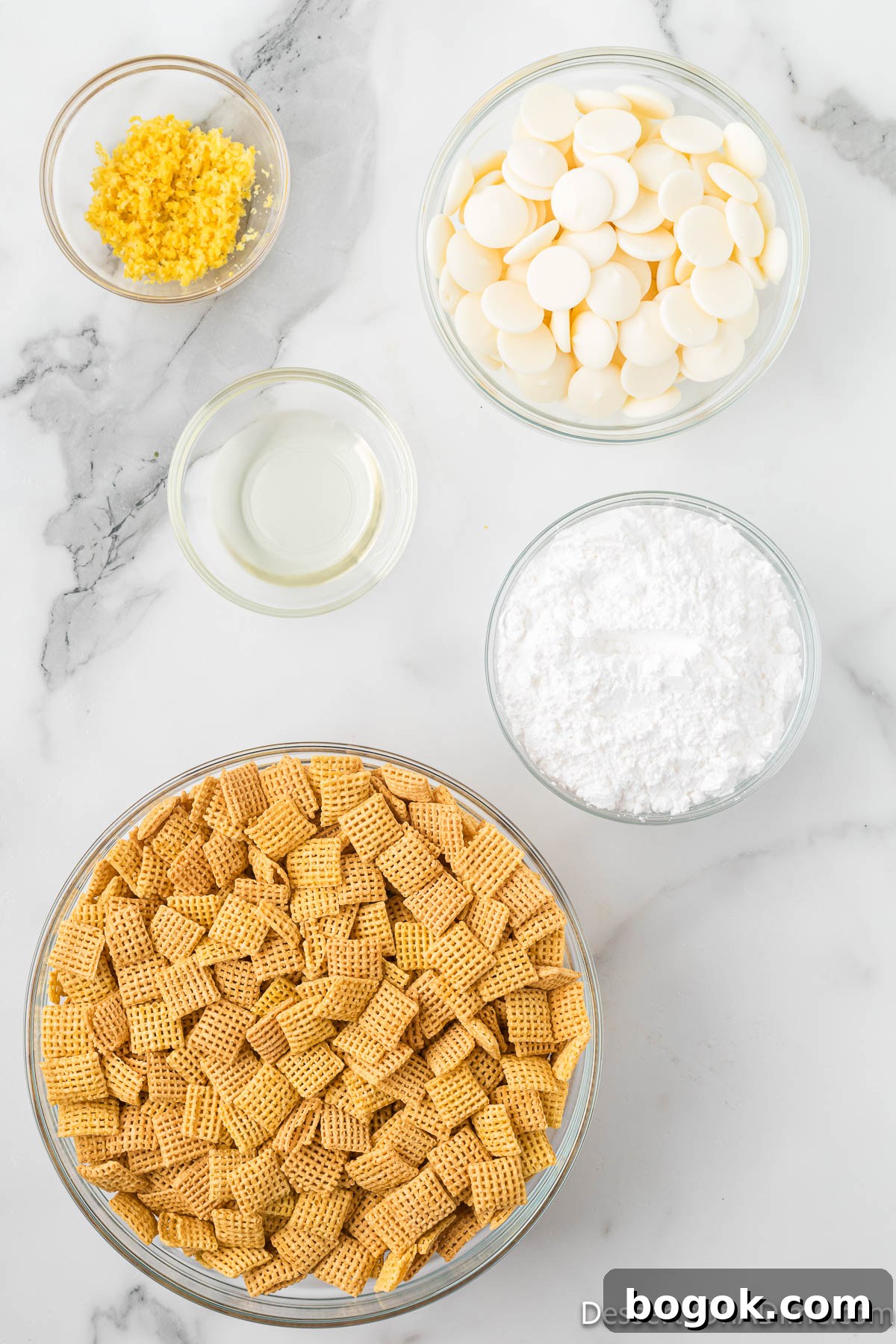 Lemony Puppy Chow Recipe: Zesty No-Bake Snack Mix 3 Ingredients for recipe - chex cereal, melting chocolate, lemon zest, powdered sugar, oil.