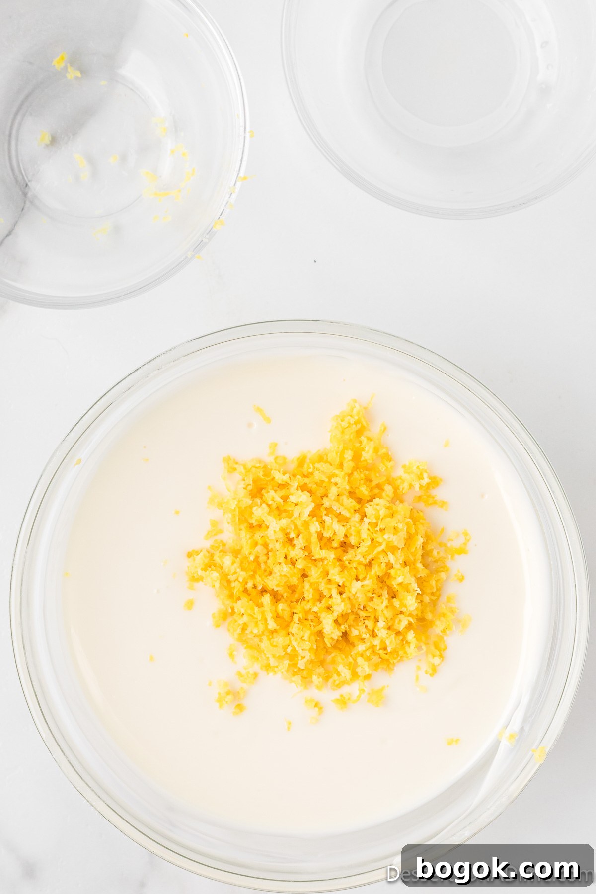 Lemony Puppy Chow Recipe: Zesty No-Bake Snack Mix 5 Lemon zest added to melted chocolate.