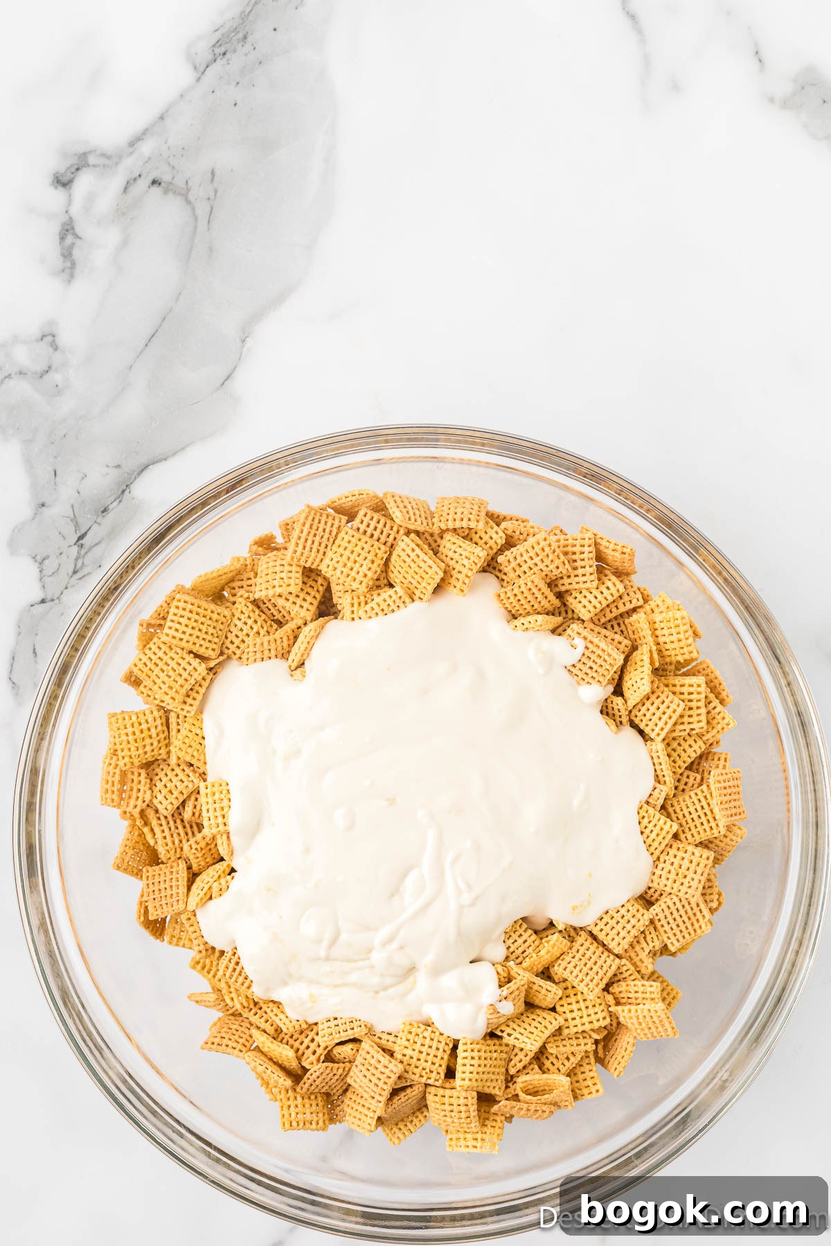 Lemony Puppy Chow Recipe: Zesty No-Bake Snack Mix 6 Melted chocolate poured on the cereal.