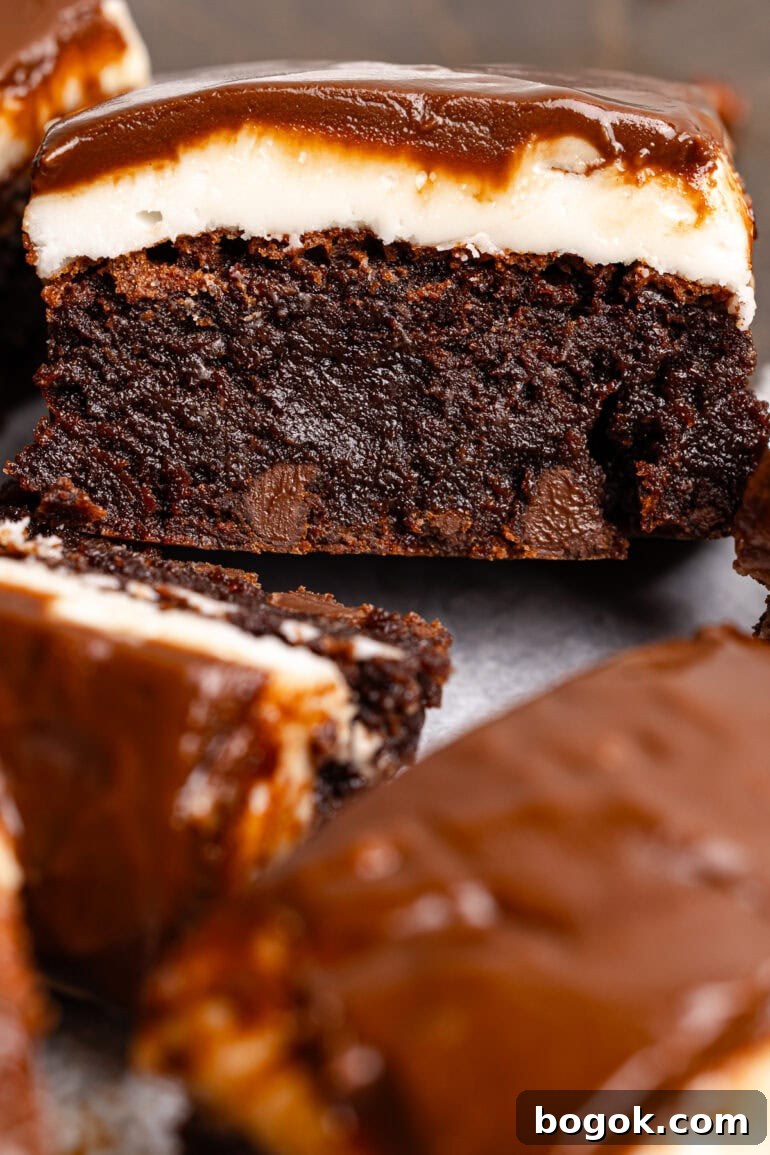 a thick and fudgy chocolate brownie with a peppermint patty layer then topped with a thin chocolate layer