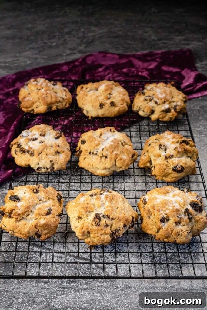 Nine simple rock cakes on a wire rack with sugar sprinkled over the top
