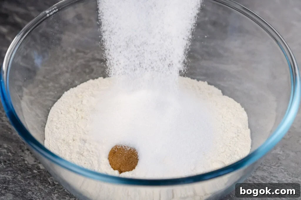 sugar added to Plain flour, mixed spice, baking soda and salt in a glass bowl