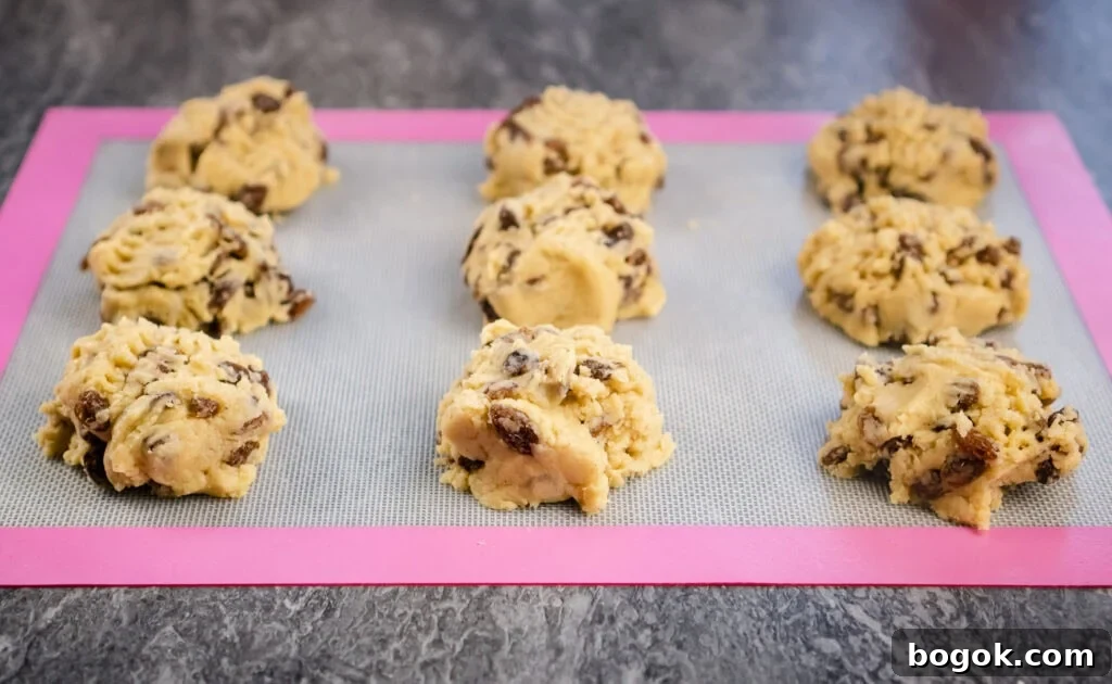 Rock cakes being on a silicone mat ready to be cooked