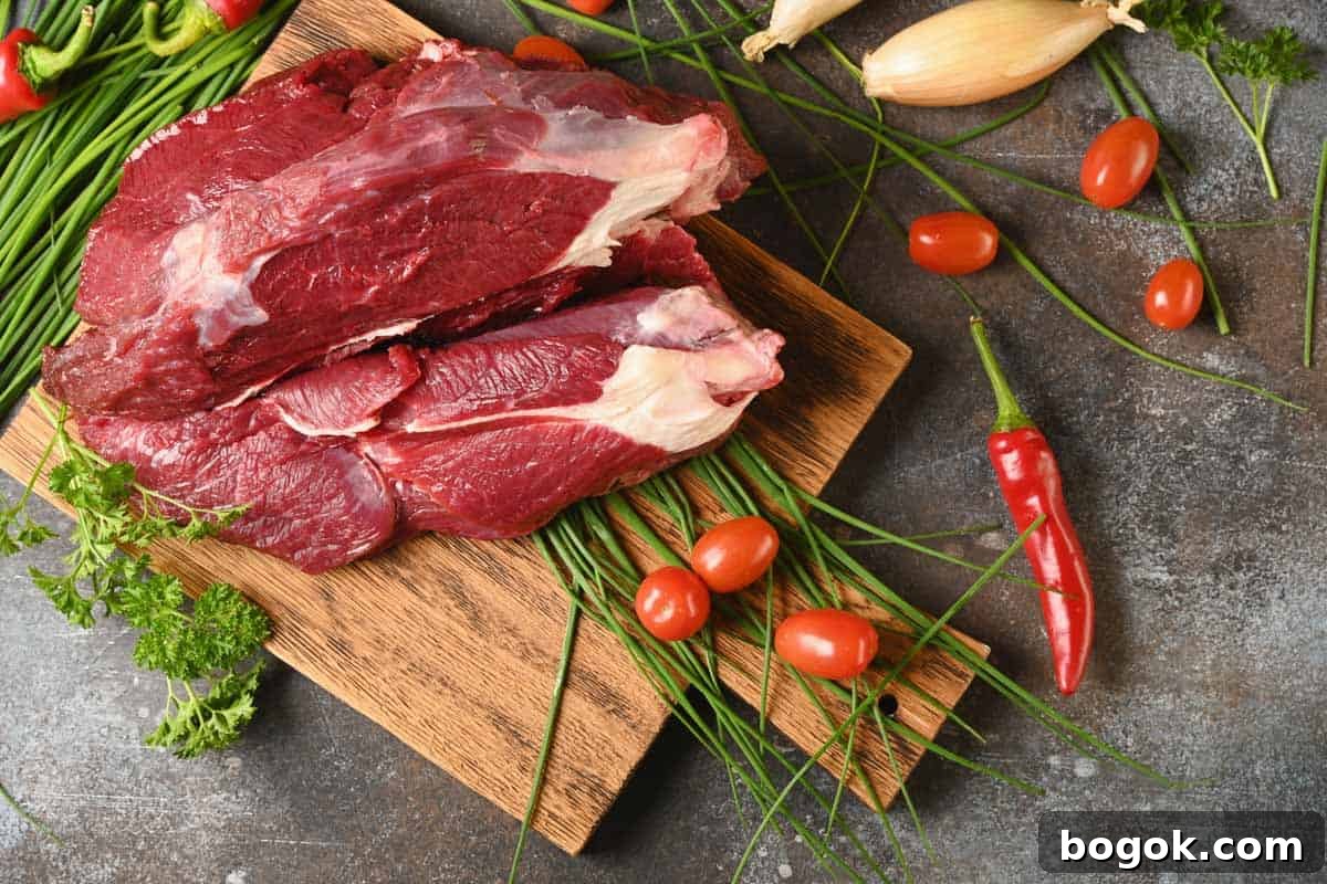 Elk Meat on cutting board with spices