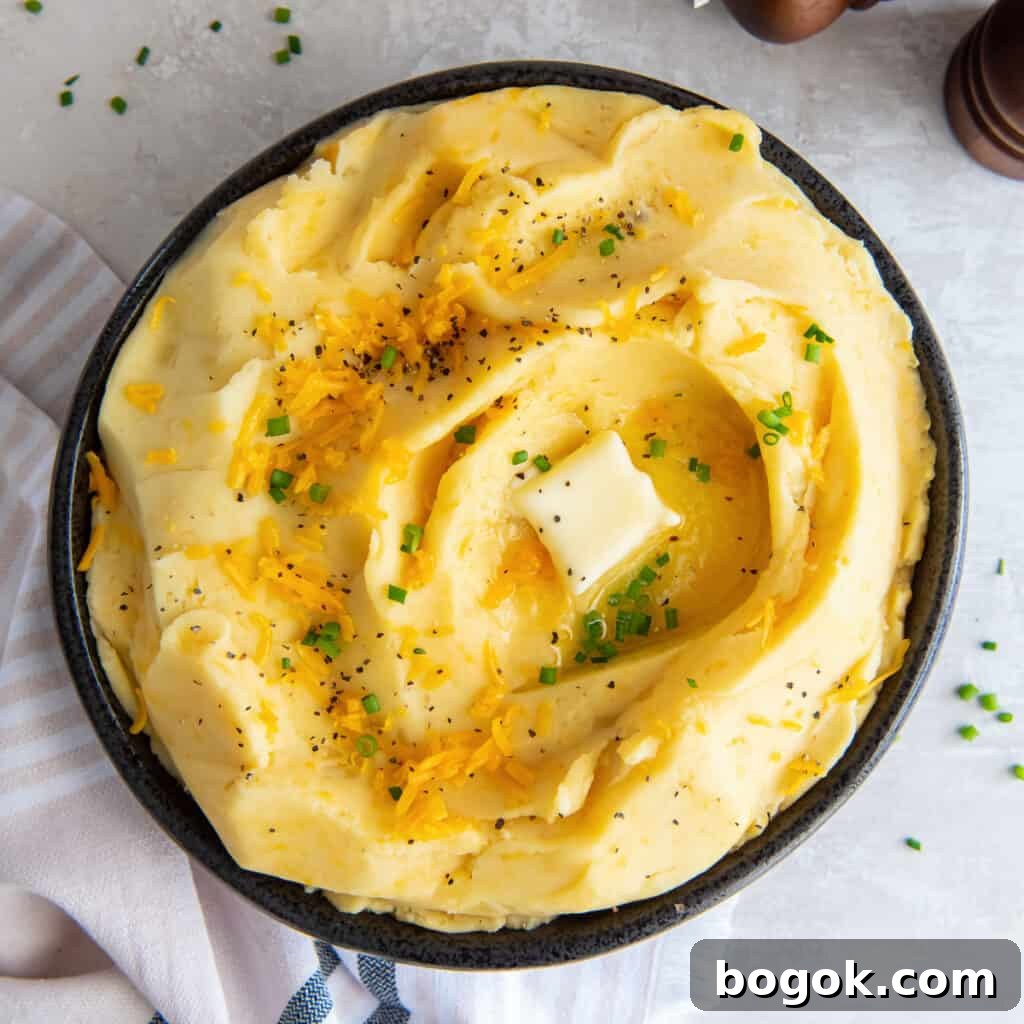Cheddar mashed potatoes topped with chives.