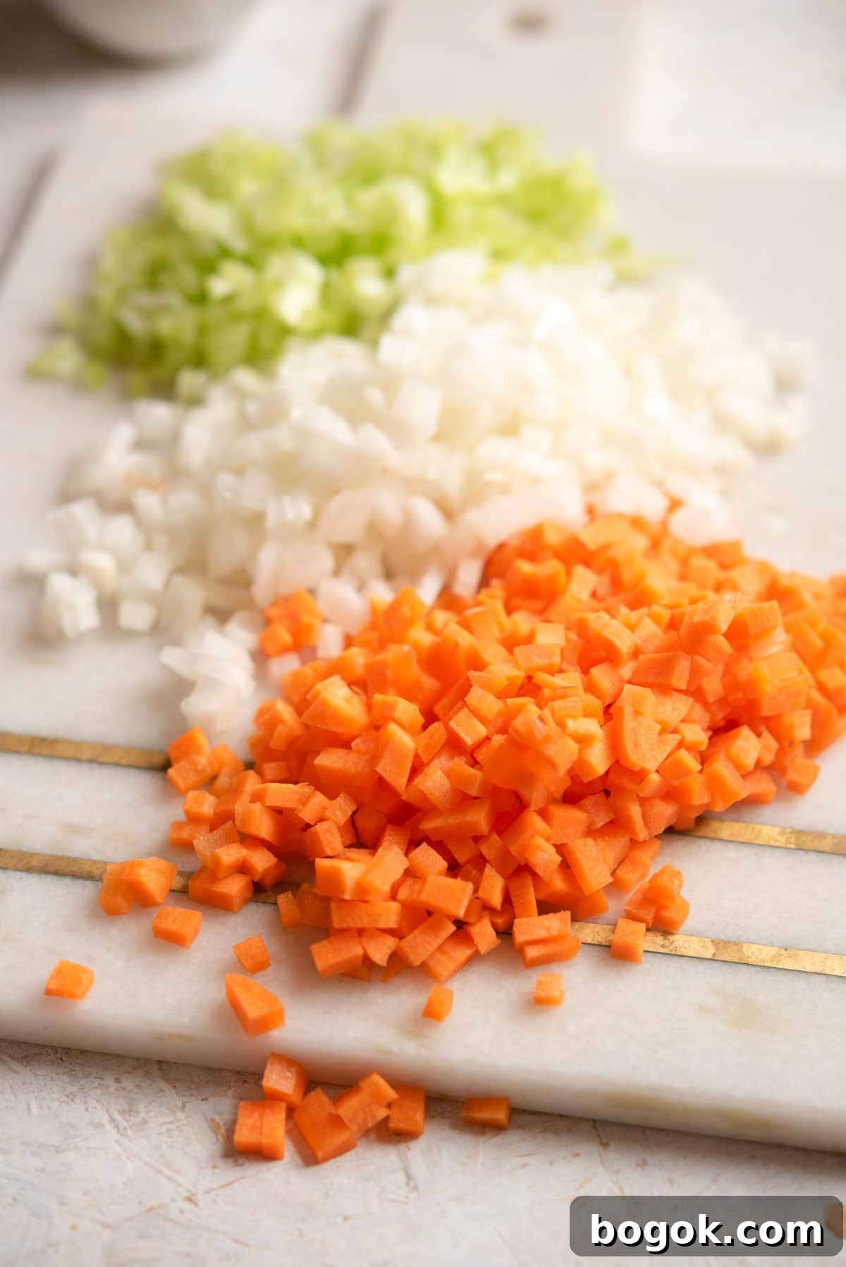 Mastering Soffritto: Classic Italian Flavor Base Recipe 5 A close up of finely chopped soffritto on a board