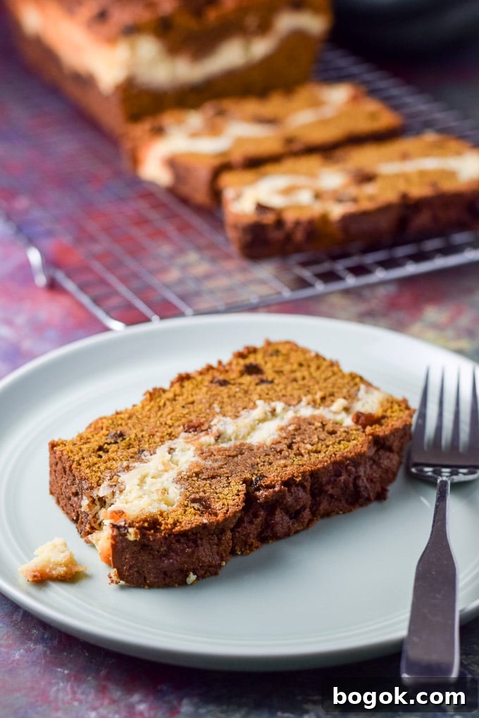 Close up of the pumpkin bread and a fork on the plate