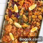 Smoky Rose Harissa: Spicy Condiment with Floral Notes 11 Top down view of harissa sheet pan chicken.
