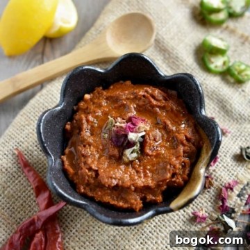 Smoky Rose Harissa: Spicy Condiment with Floral Notes 14 close up of rose harissa on burlap in brown bowl