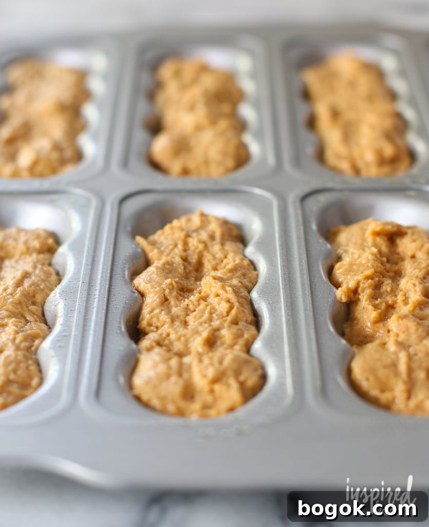 pumpkin donut batter in a pan.
