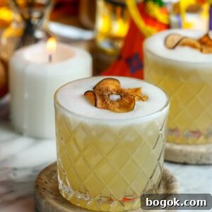Classic Tequila Sour Cocktail Recipe — How to Make It Perfectly 4 A beautiful cocktail with a foam top, garnished with a dried pear.
