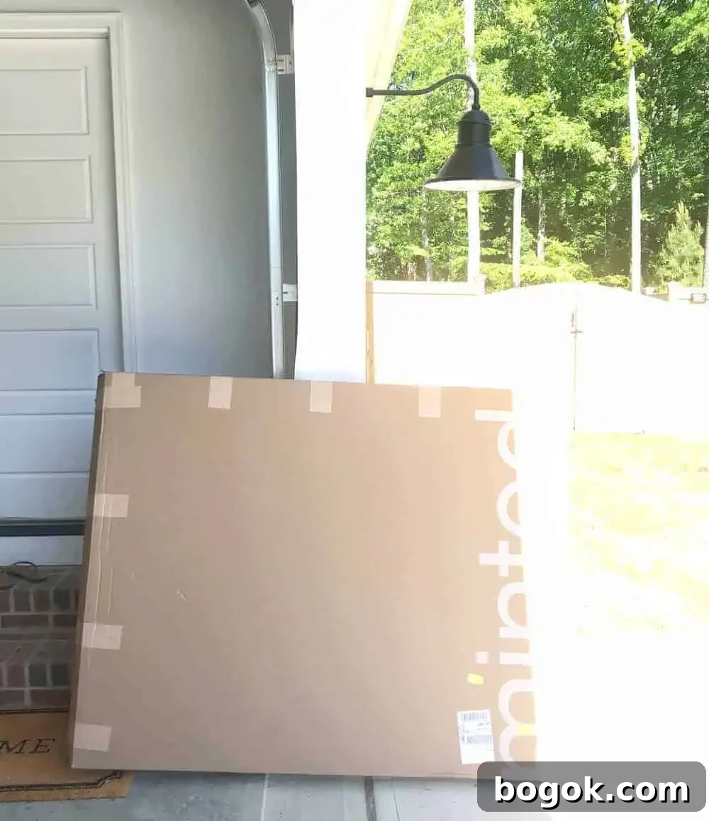 a package of oversized art that says Minted on the box outside my garage