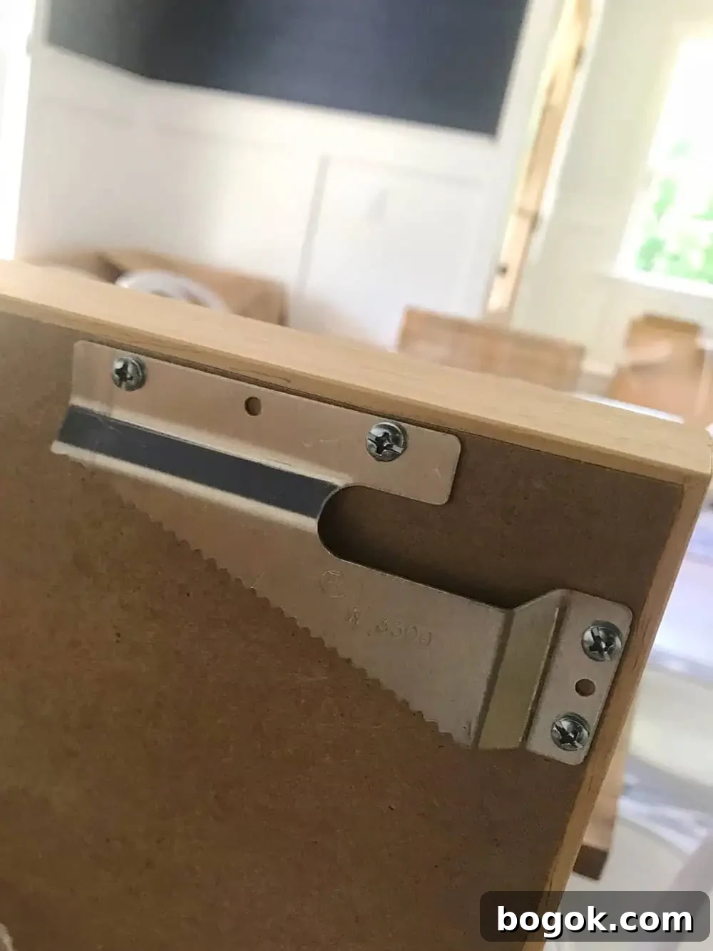the back of the art showing the hooks for putting it on the wall.