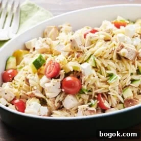 Black bowl of Greek Chicken Pasta Salad.