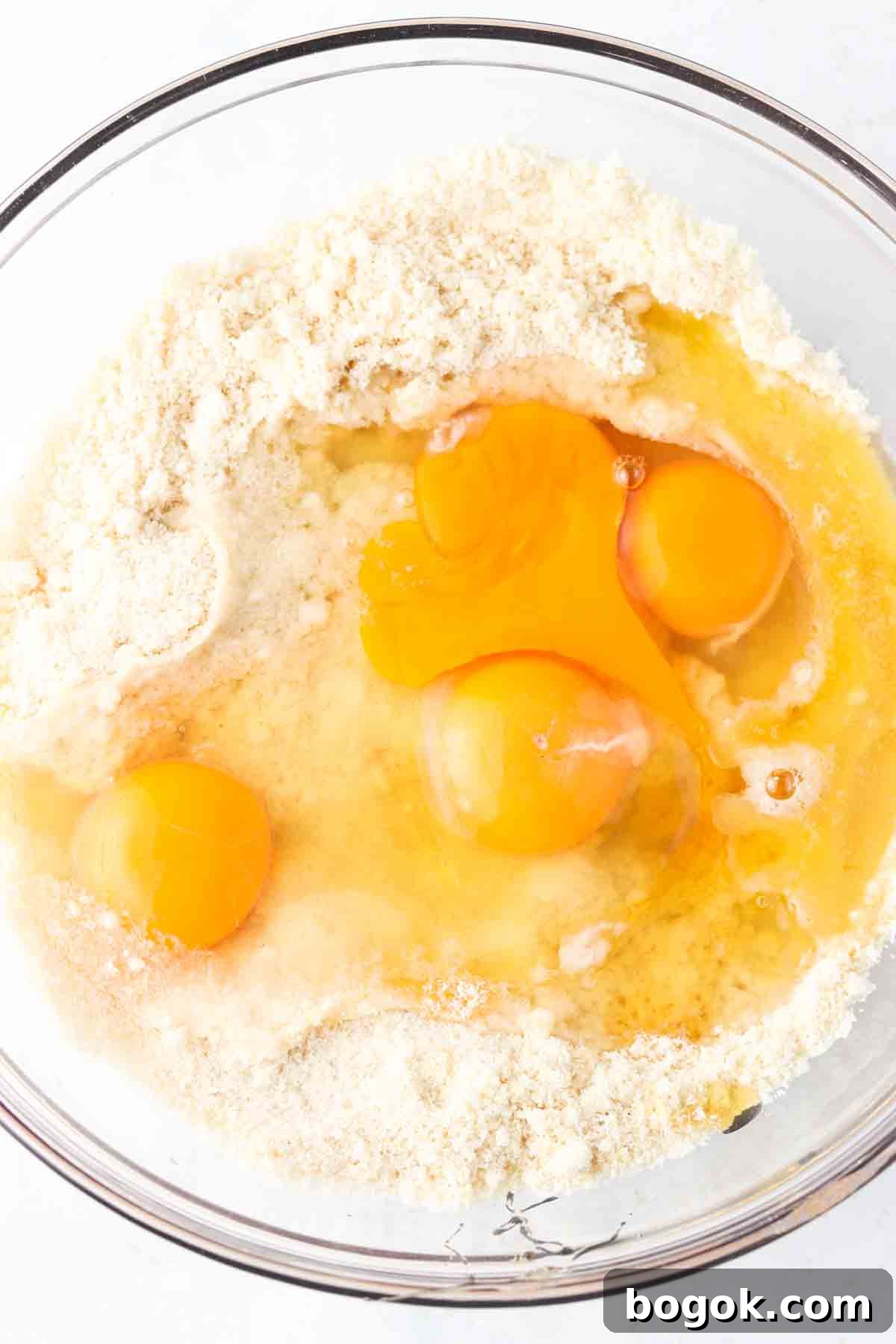 Eggs mixed in with almond flour, sea salt, honey, and baking soda.