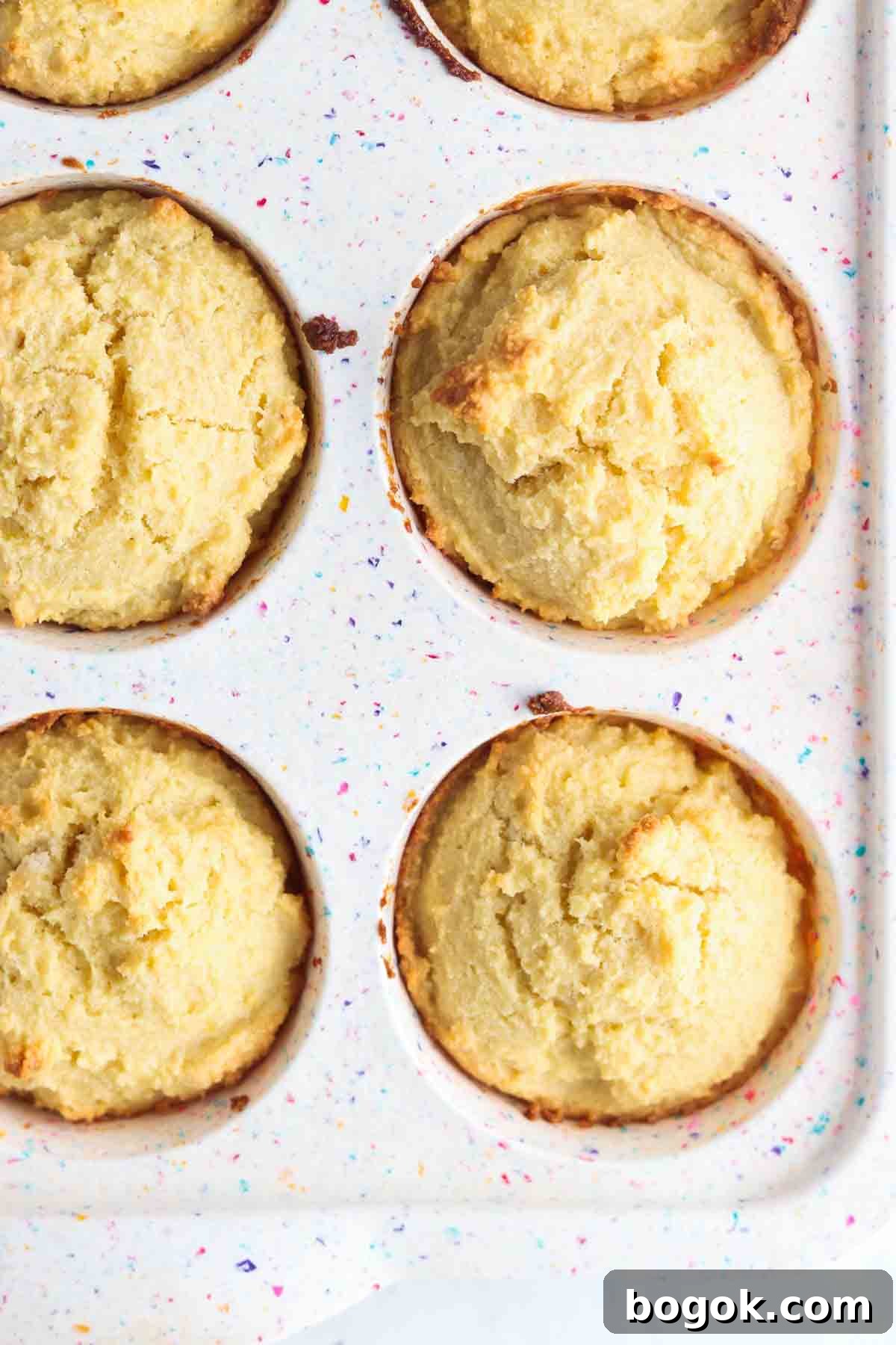 Biscuits inside a muffin pan mold.