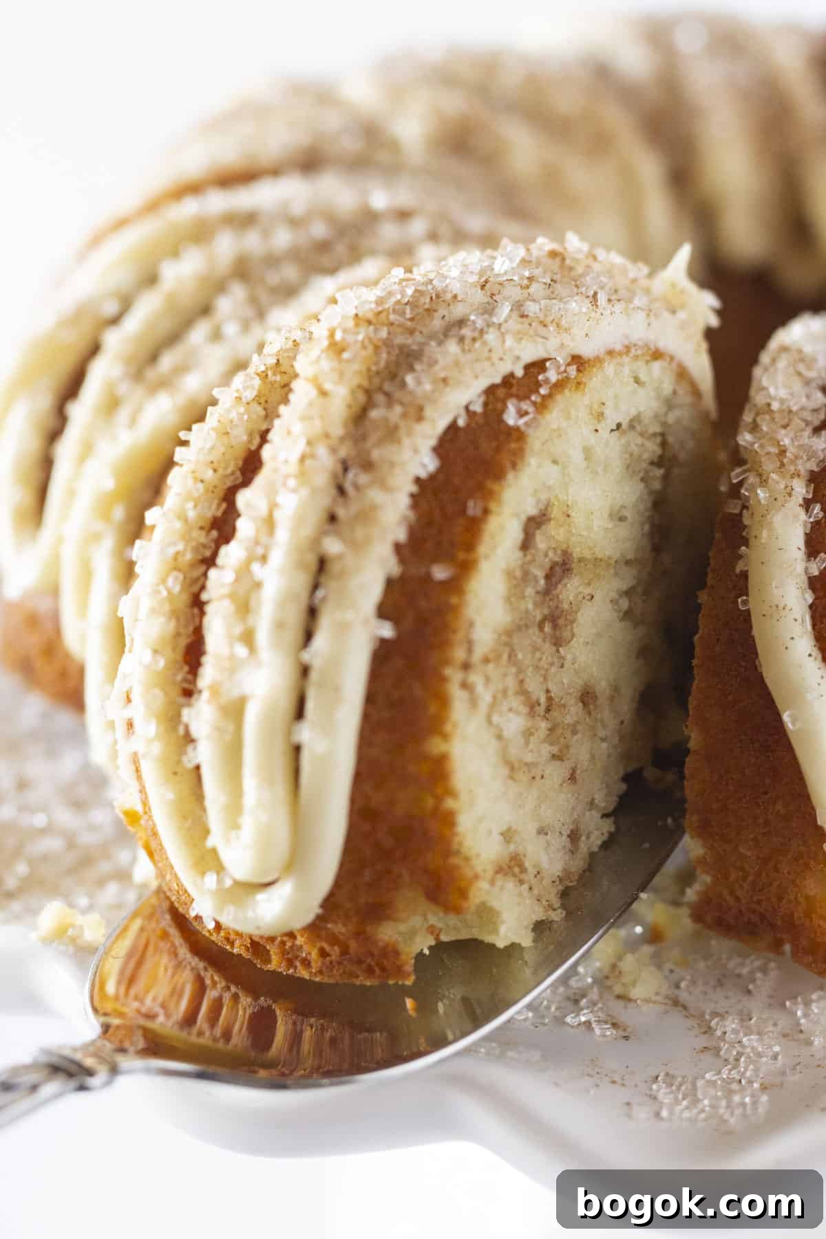 Serving a piece of Snickerdoodle Bundt Cake.