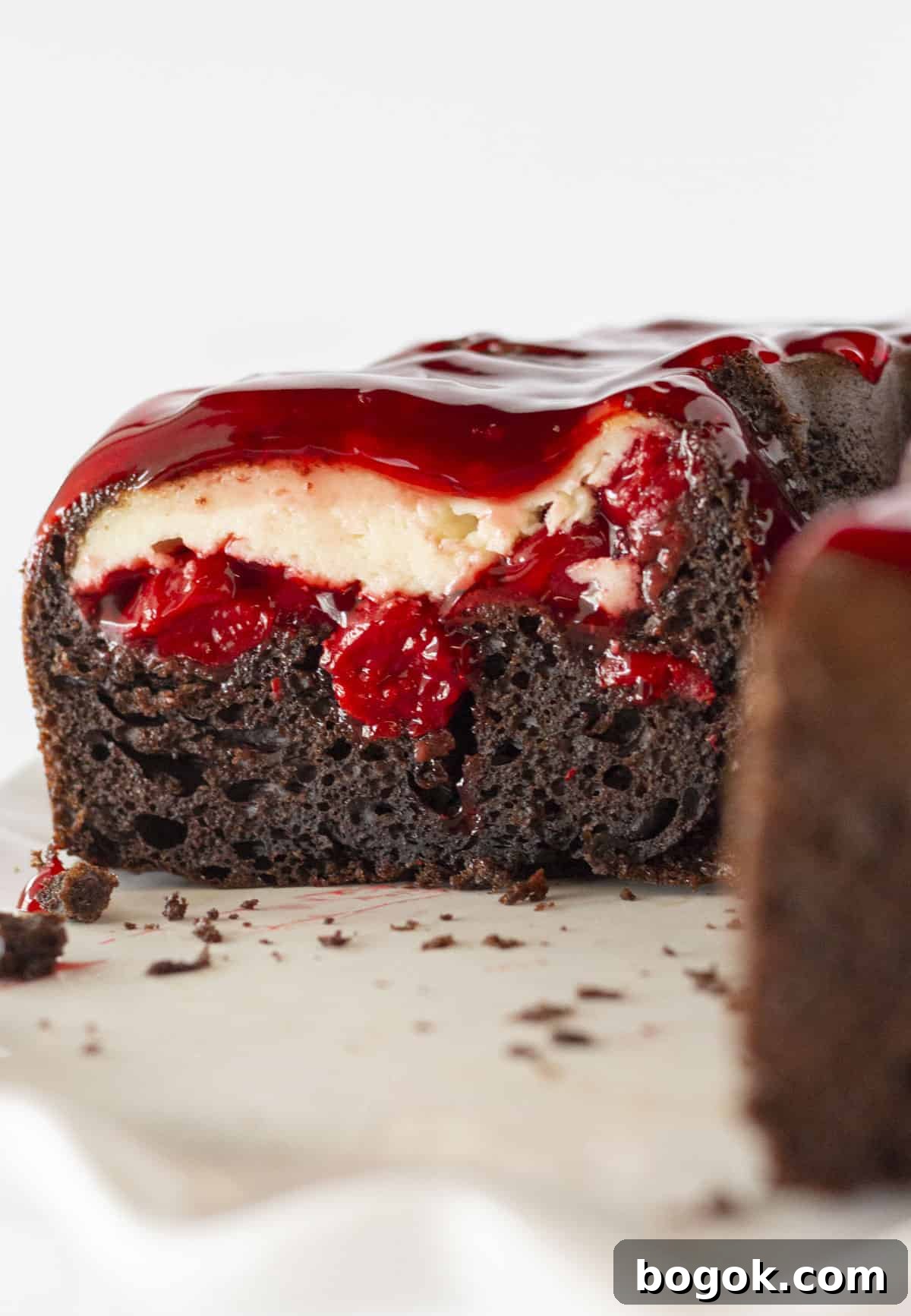 The inside of a chocolate cherry cheesecake cake.