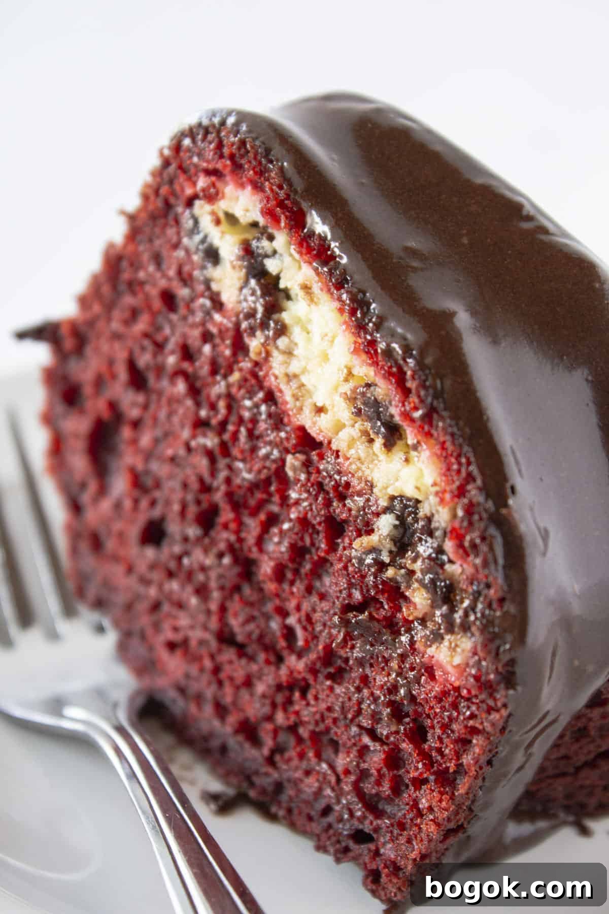 A slice of Red Velvet Black Bottom Cake.