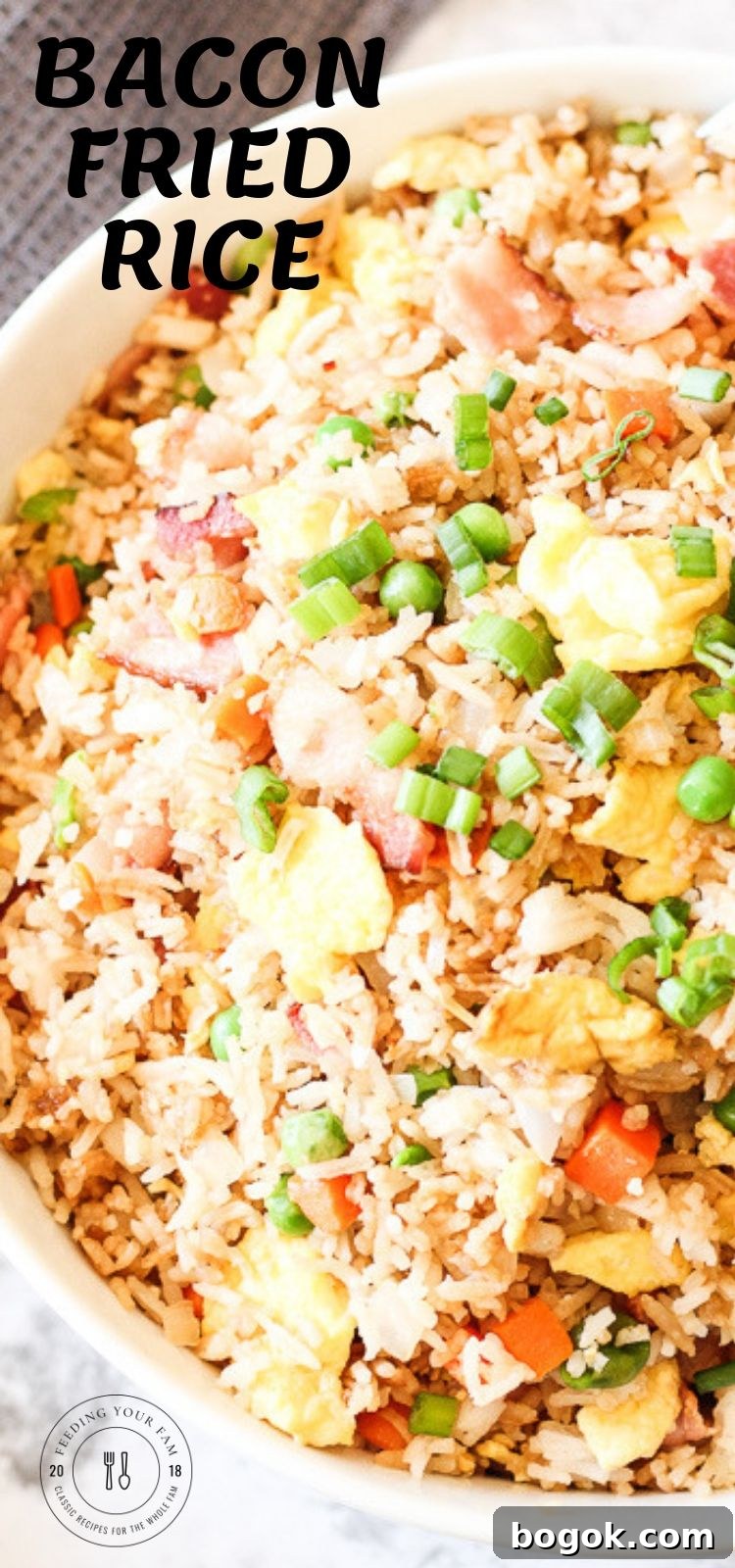 Bacon Fried Rice is a simple go to dish that is full of vegetables, rice and of course bacon! This is a staple recipe around our house, we usually have all of these ingredients on hand and this can be made quick. Dinner win!! #friedrice #bacon #ricerecipes closeup of fried rice