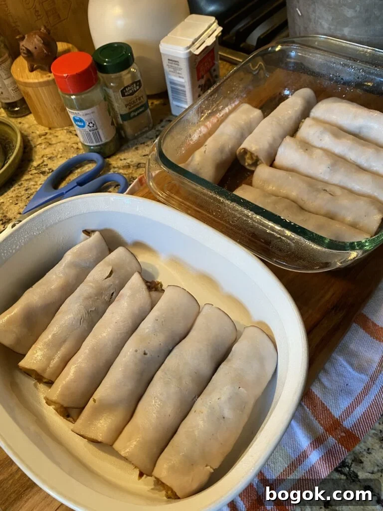 Slices of deli turkey wrapped around stuffing in baking dishes
