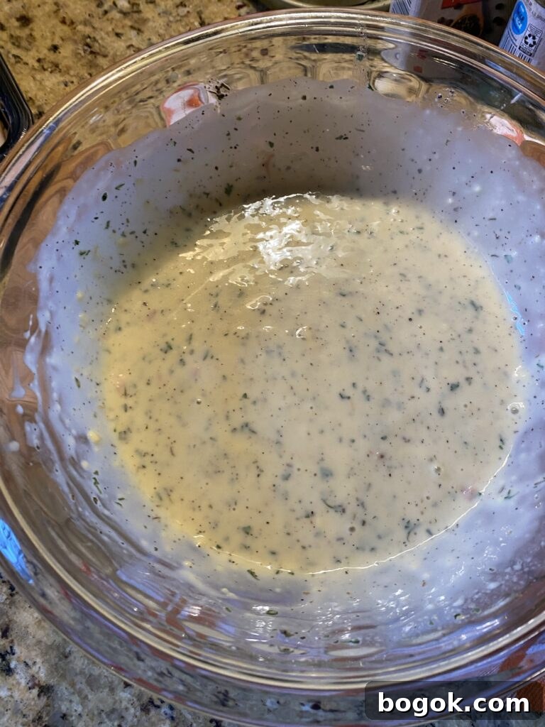 A glass bowl of creamy gravy