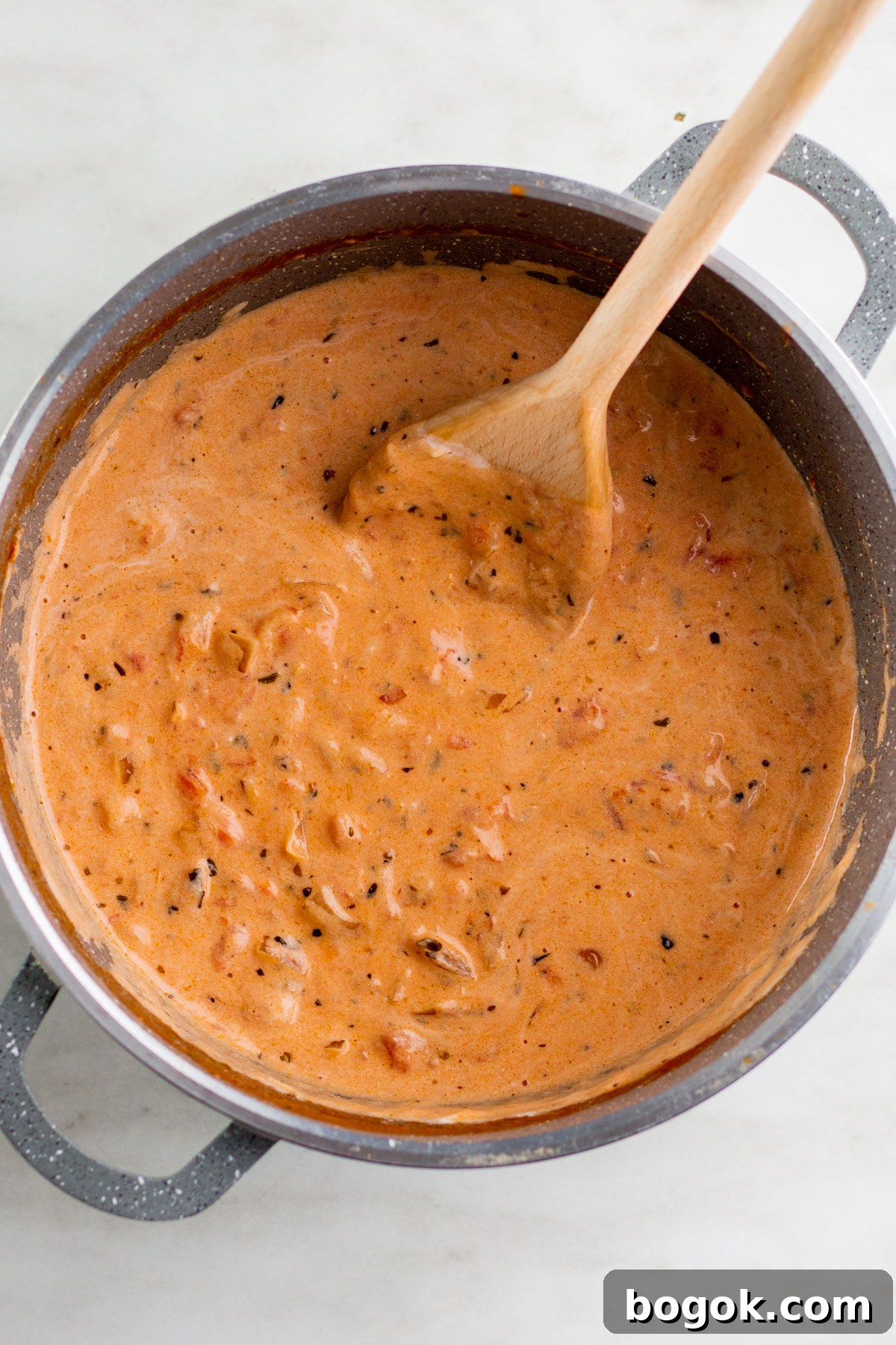 combine pasta with pink sauce