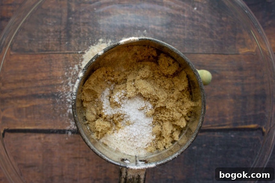 a sifter with brown sugar, salt, and flour in it