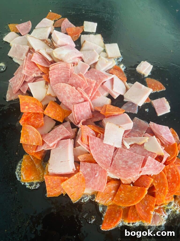 Blackstone Chopped Italian Sandwiches Recipe 4 chopped deli meat on the griddle