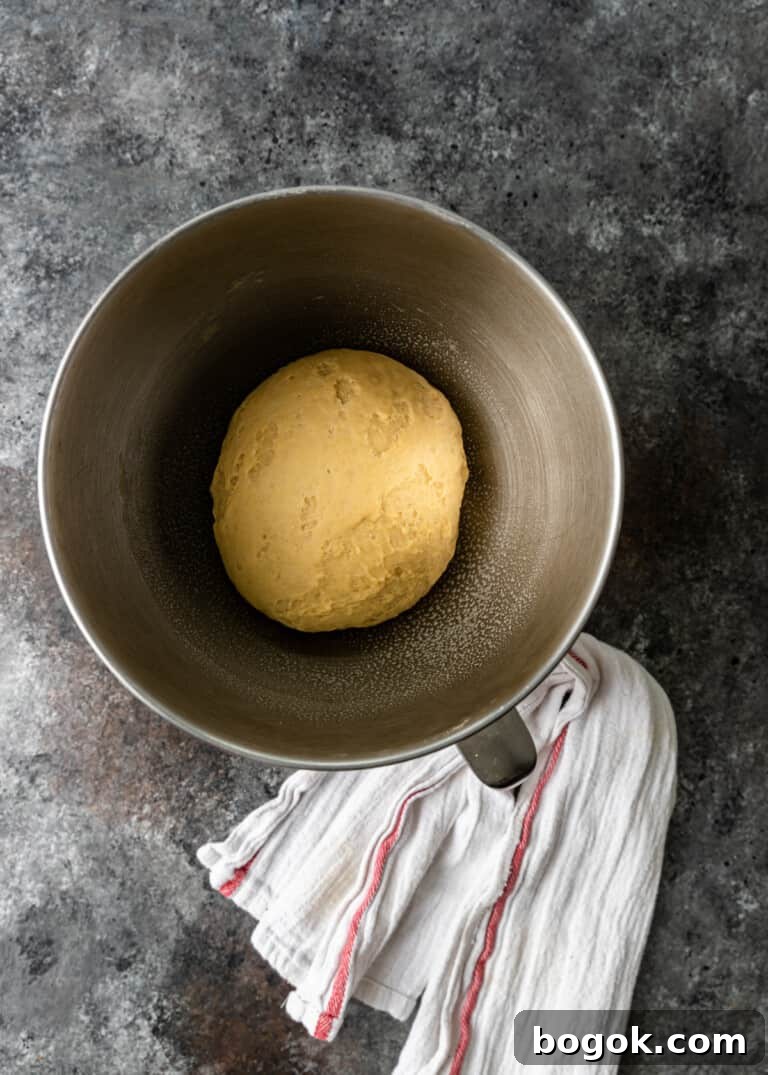 Authentic Challah Recipe: Soft, Braided Jewish Bread Tutorial 5 overhead process shot titled image (and shown) kneaded