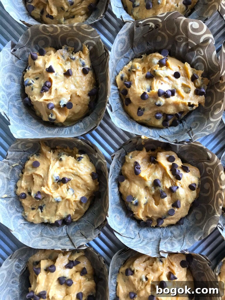 raw muffin batter in a muffin tin