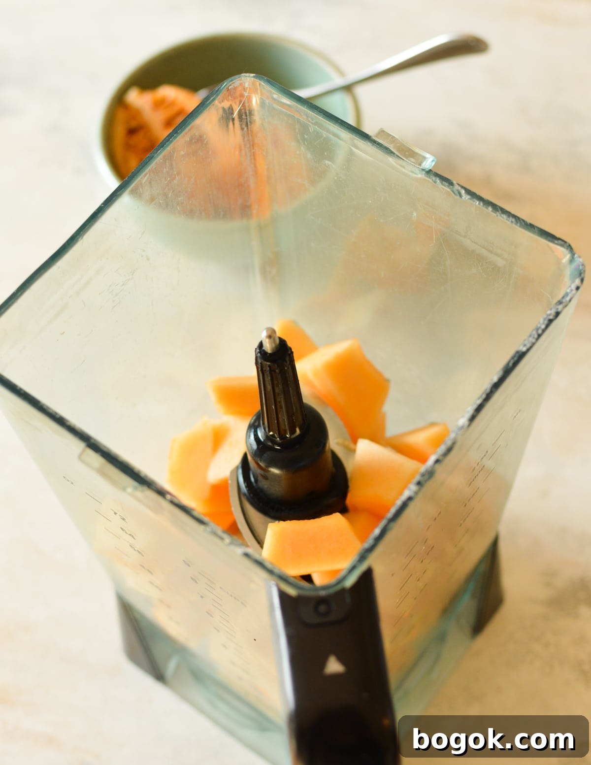 Refreshing Cantaloupe Juice Recipe: Cold, Natural & Delicious 11 a blender full of cantaloupe chunks.