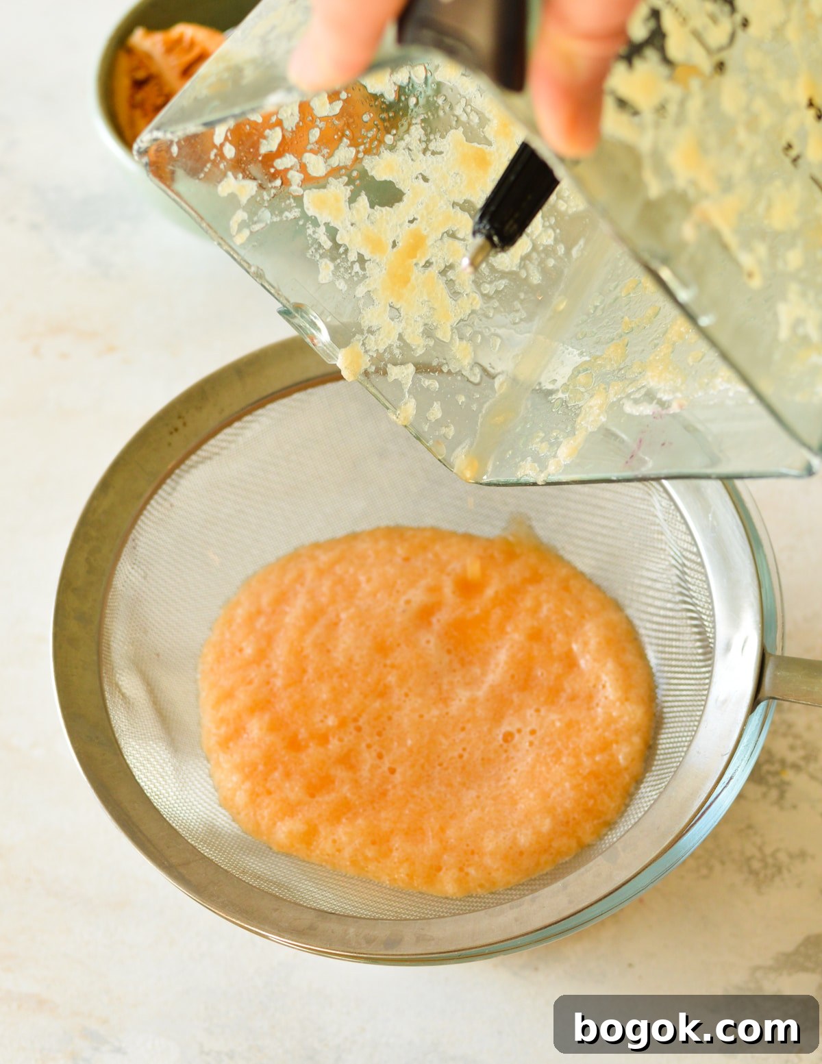 Refreshing Cantaloupe Juice Recipe: Cold, Natural & Delicious 13 cantaloupe puree in fine mesh sieve,