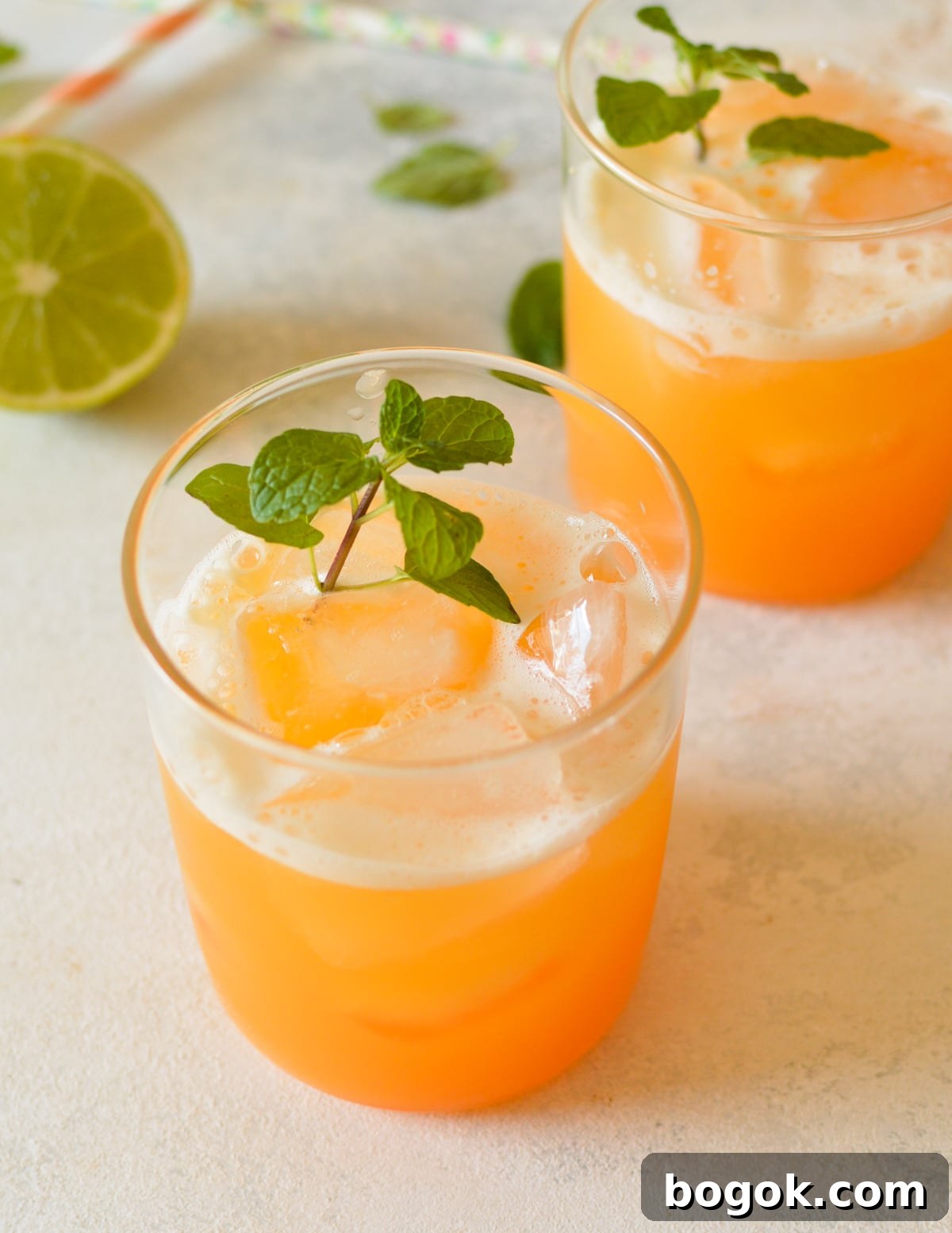 Refreshing Cantaloupe Juice Recipe: Cold, Natural & Delicious 17 two glasses of cantaloupe juice with mint