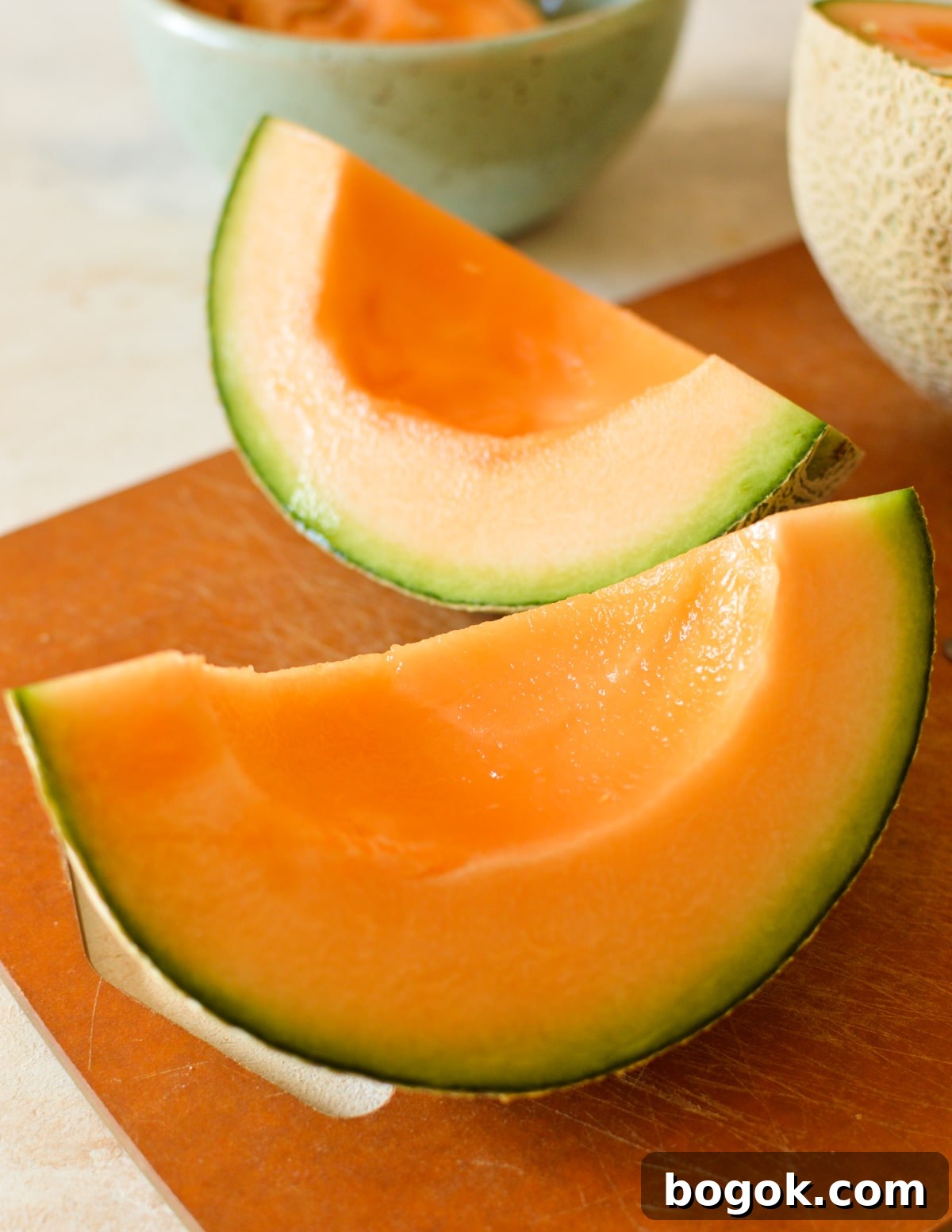 Refreshing Cantaloupe Juice Recipe: Cold, Natural & Delicious 6 a third of a cantaloupe on cutting board,