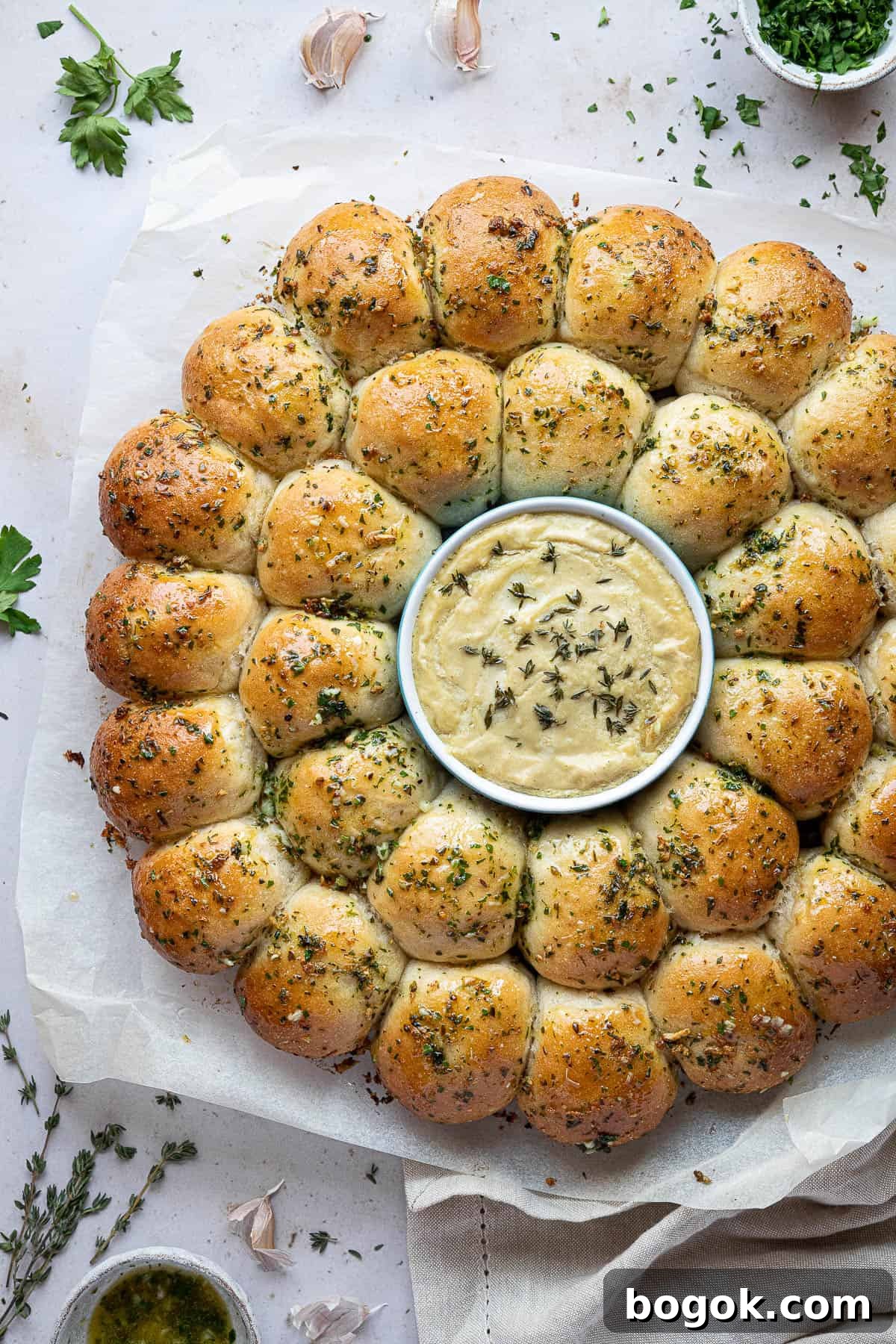 Close up of garlic dough balls with cheese dip.