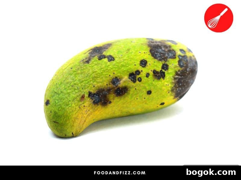 Black Spots on Mangoes: Causes and Is It Safe to Eat 4 Bacterial black spots appear as irregular, raised black spots on the skin of mangoes and are caused by bacteria.