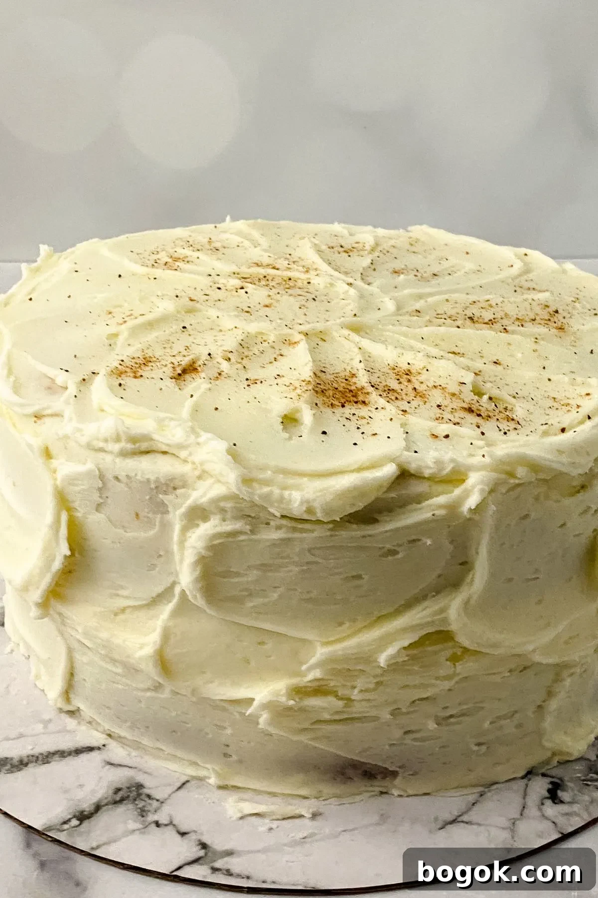 A gluten and dairy free eggnog cake with eggnog icing.