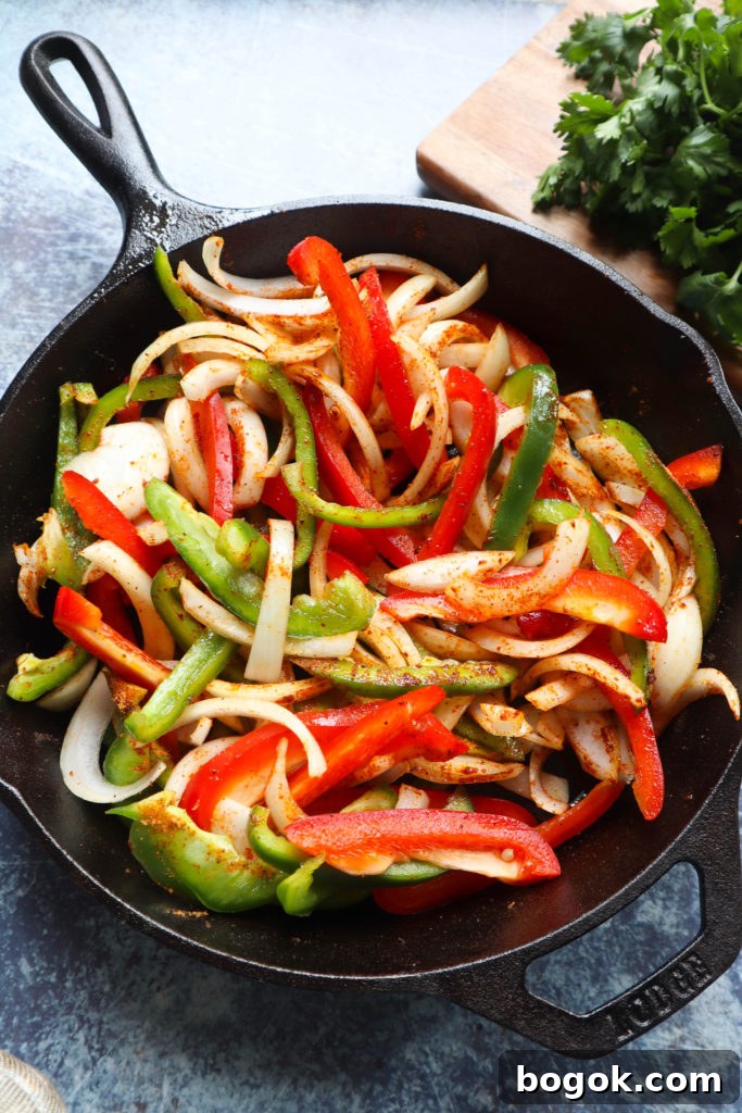 Crispy Chicken Fajitas Recipe with Peppers and Onions 5 Cooking crispy chicken fajitas in a skillet