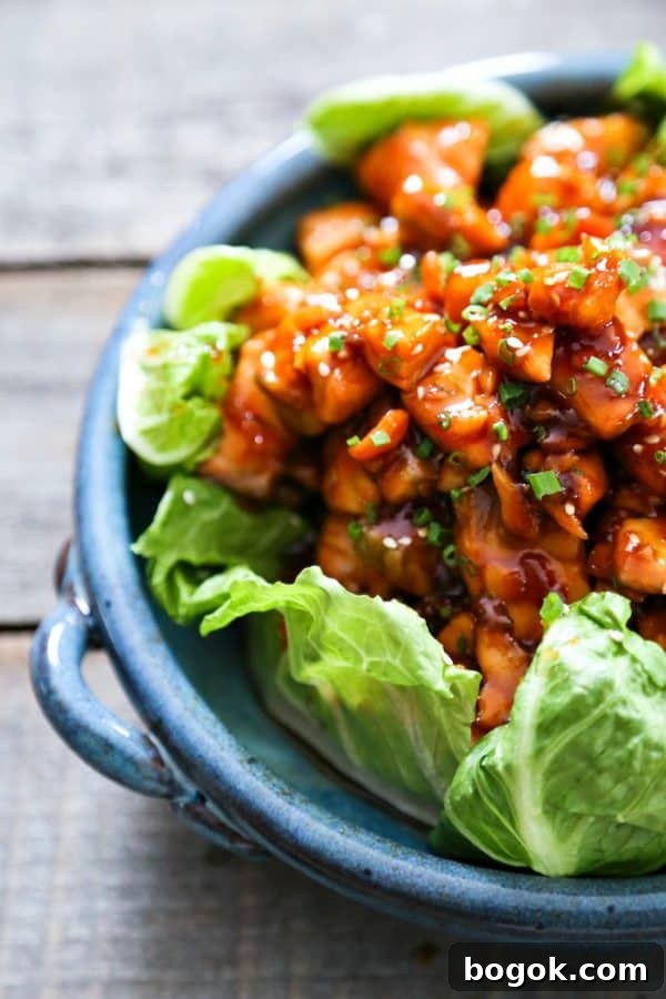 Honey Sriracha Glazed Salmon Bites: Tender salmon tossed in a sticky, sweet, spicy mahogany sauce. Serve in lettuce wraps, or on hot rice.