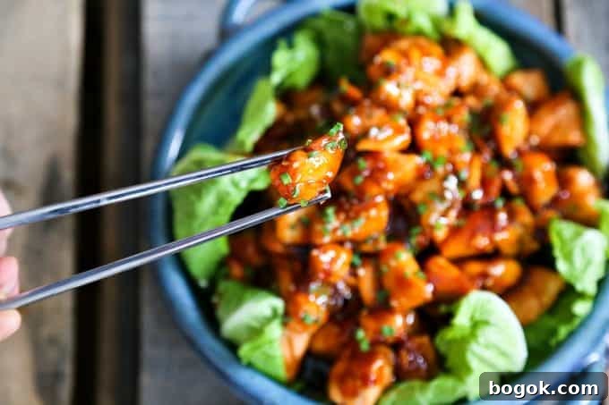 Honey Sriracha Glazed Salmon Bites: Tender salmon tossed in a sticky, sweet, spicy mahogany sauce. Serve in lettuce wraps, or on hot rice.