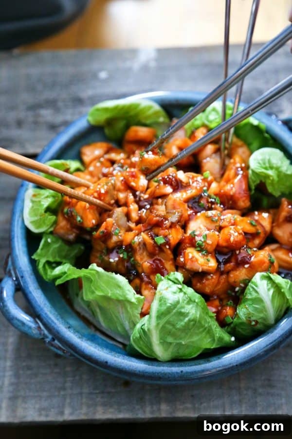 Honey Sriracha Glazed Salmon Bites: Tender salmon tossed in a sticky, sweet, spicy mahogany sauce. Serve in lettuce wraps, or on hot rice.