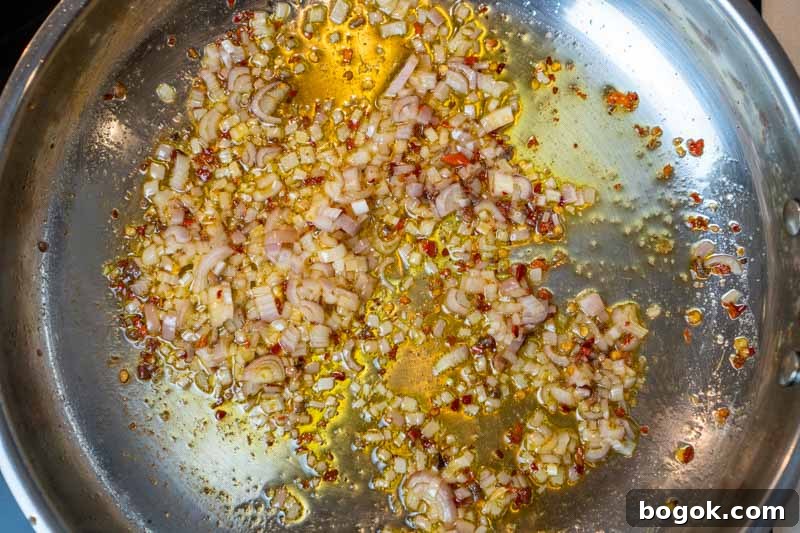 Spicy Spaghetti all'Arrabbiata Recipe with Garlic and Chili 4 Cooking the shallot