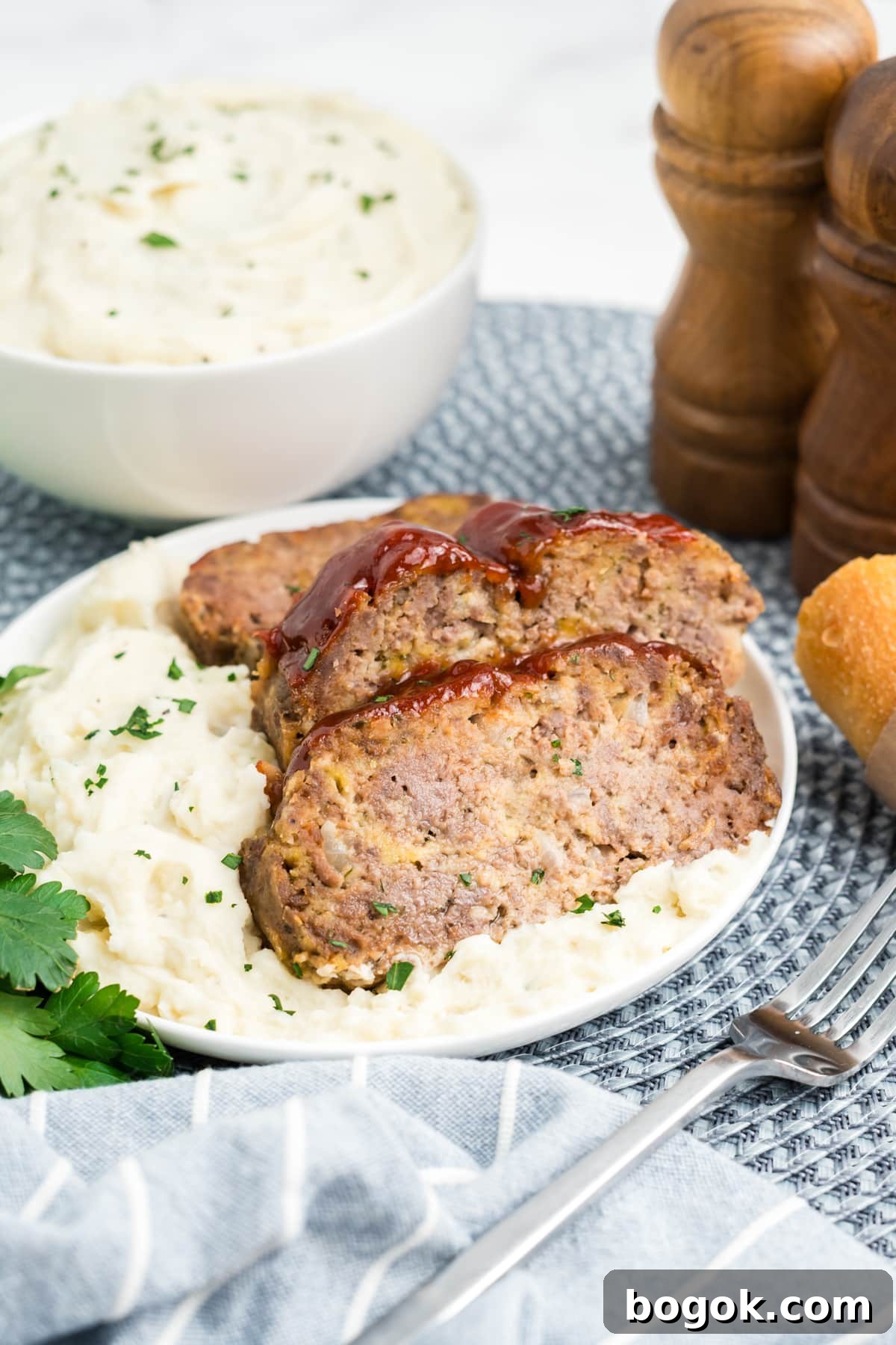 Meatloaf on a plate sliced up.