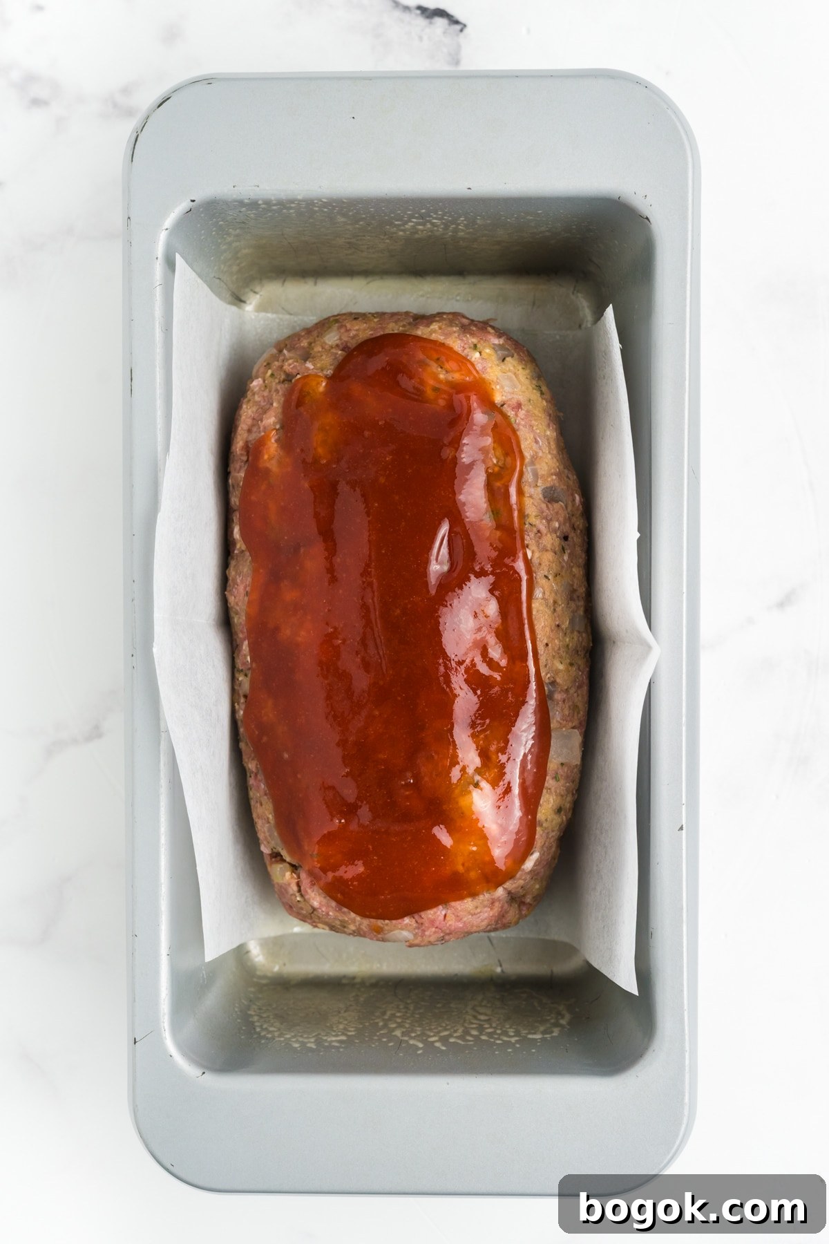The glaze mixture on the meatloaf.