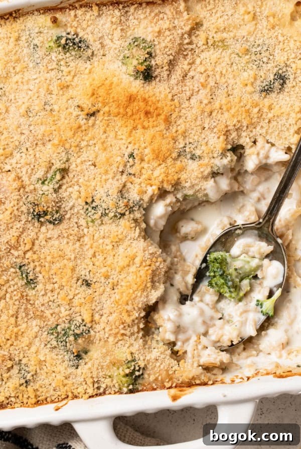 Boursin-Stuffed Mushrooms with Garlic and Herbs 13 A white baking dish with a cheesy broccoli rice casserole inside.