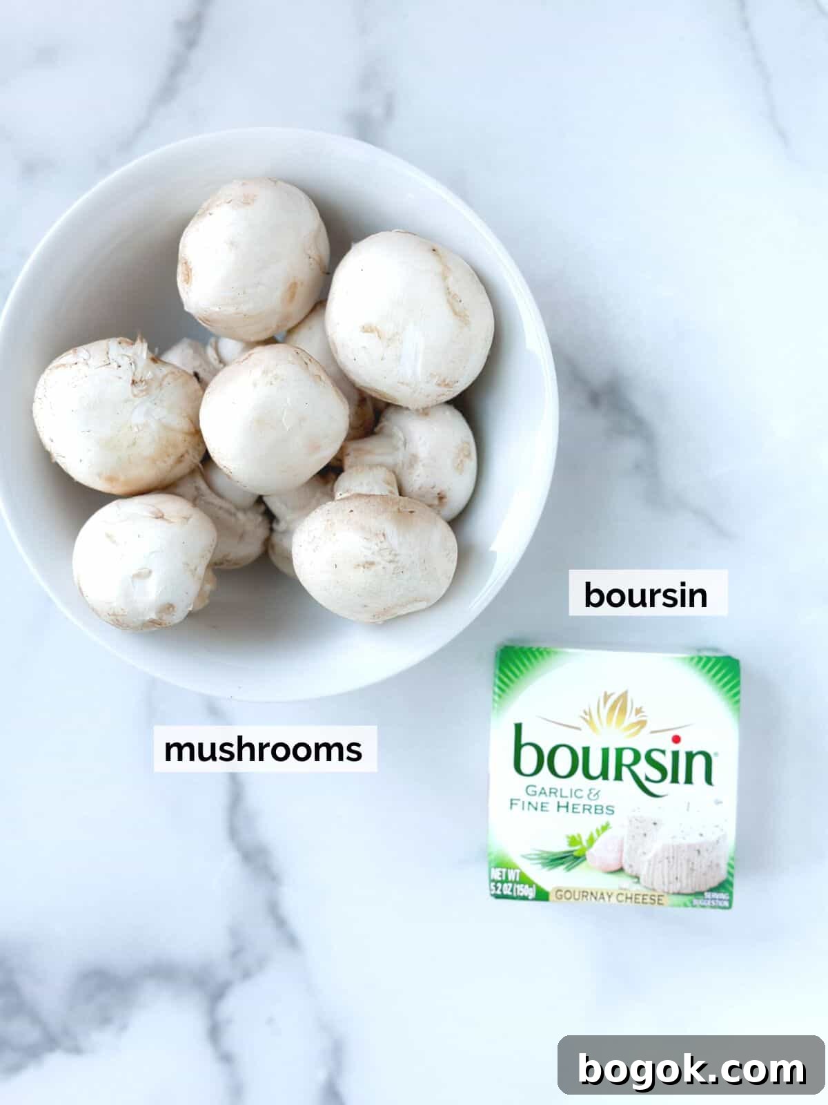 Boursin-Stuffed Mushrooms with Garlic and Herbs 3 Boursin cheese and mushrooms on a marble table.