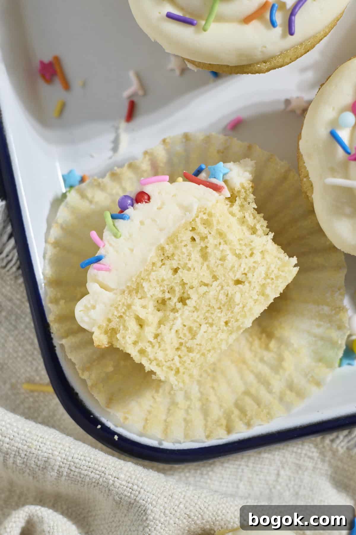 A Sourdough Vanilla Cupcake cut in half.