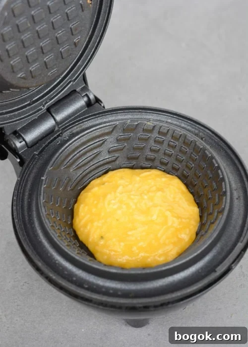 Learn how to make a chaffle bowl for a fun low carb meal prep! This easy keto chaffle bread bowl is great for salads, breakfast bowls, and more!